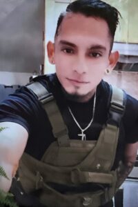 Man in Green Vest