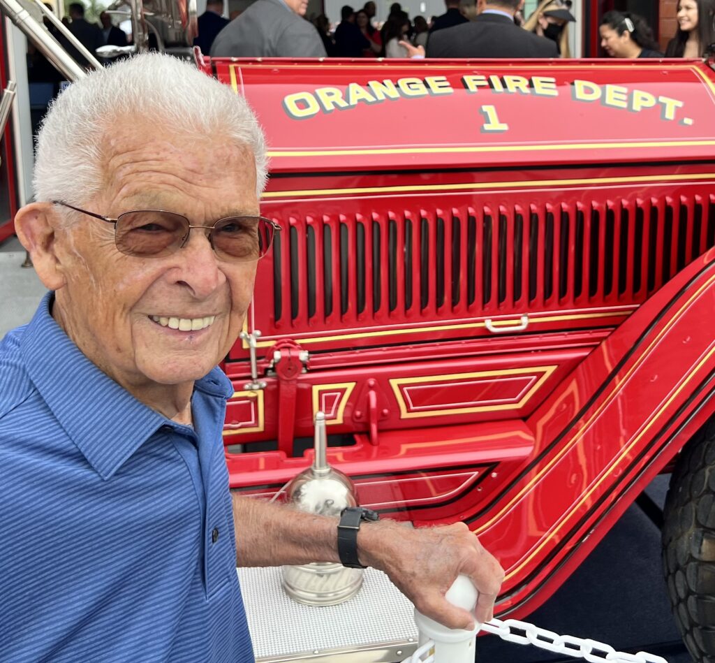 Smiling Man in front of fire engine