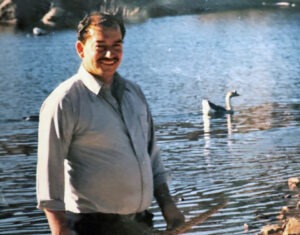 Man Standing in Front of Lake