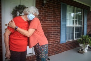 Two women hugging