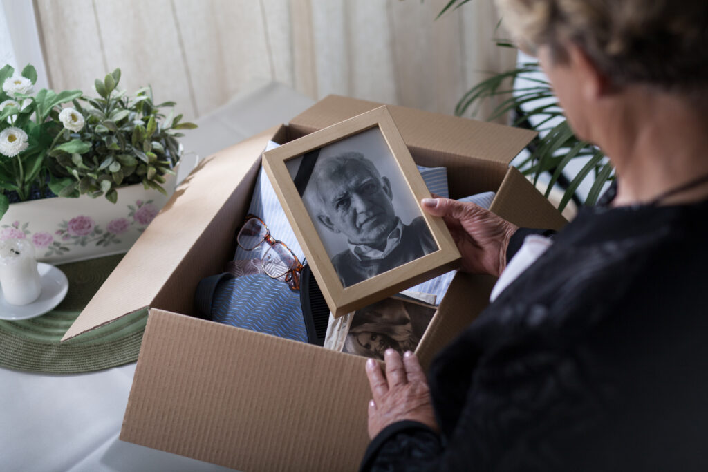 Woman looking at photograph of man