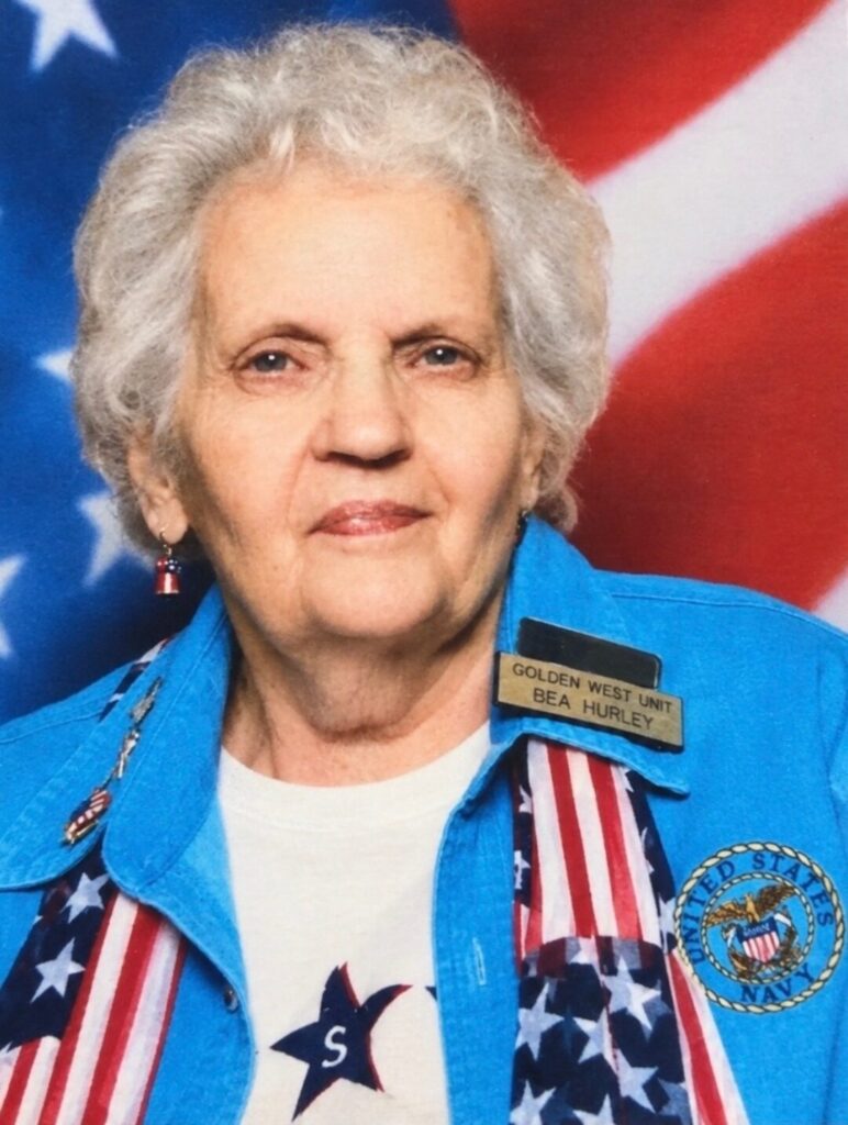 Woman in front of American Flag