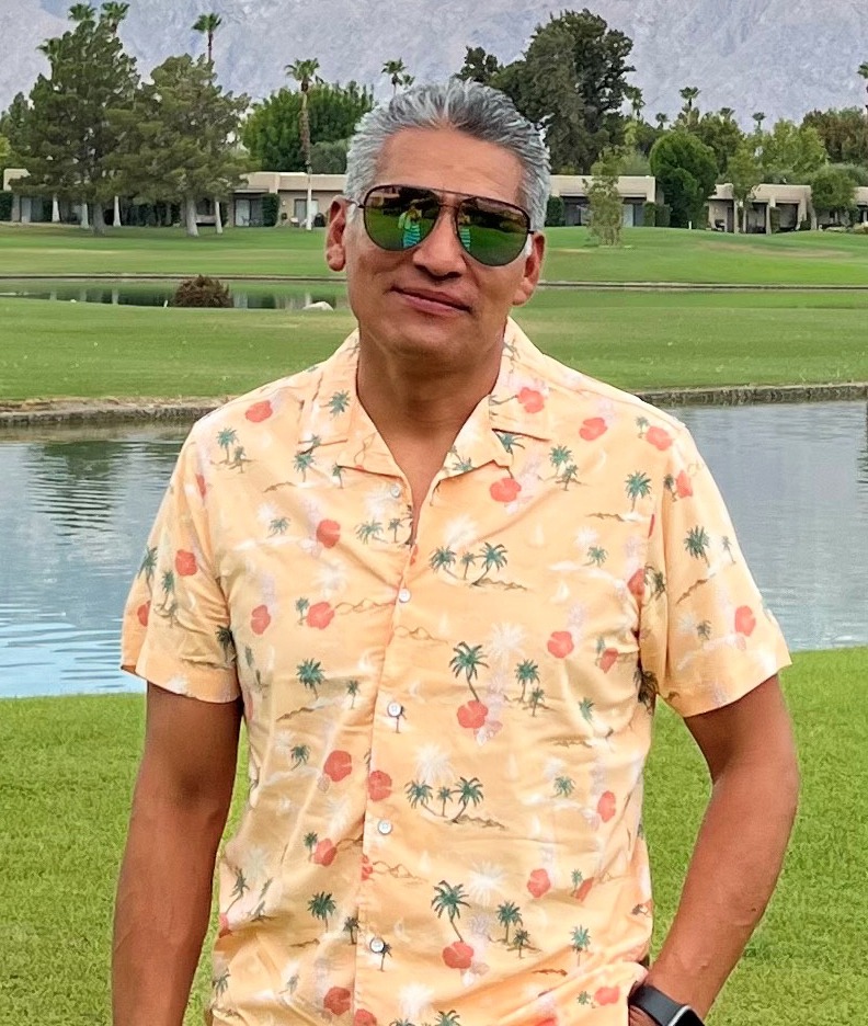 Man in yellow shirt at a golf course