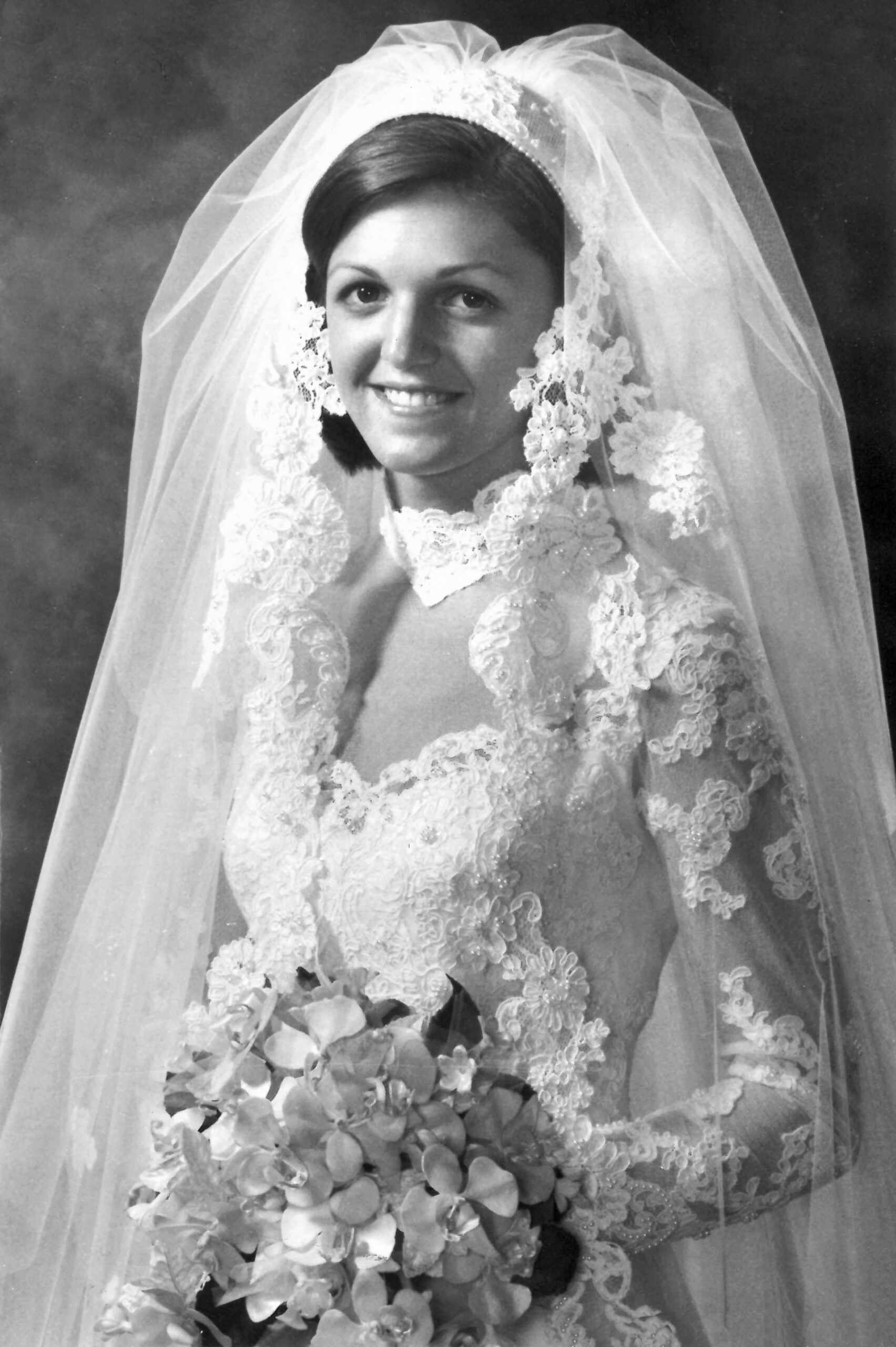 black and white photo of woman in wedding dress