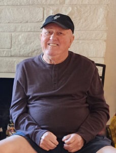 Smiling Man in Dark Hat