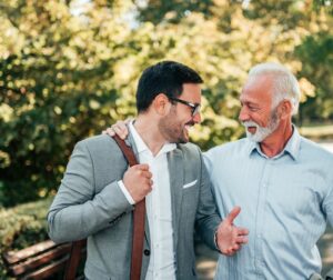 Young man and older man talking