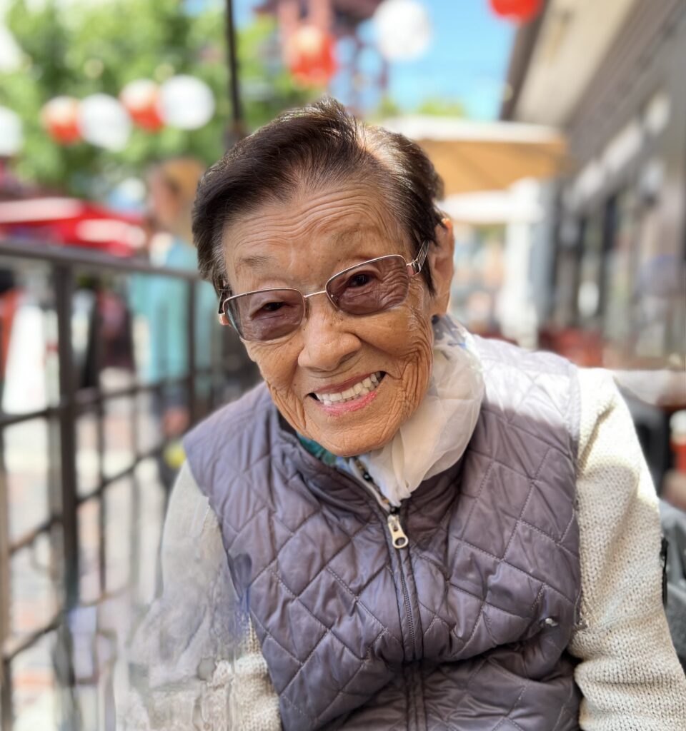 Smiling Woman in Vest