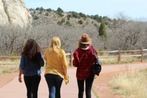 Three girlfriends hiking in the wilderness