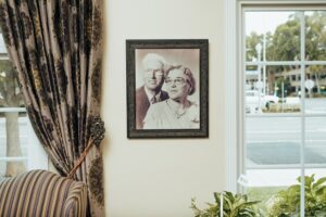 Black and white picture of man and woman on wall