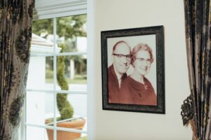 Sepia colored picture of man and woman on wall