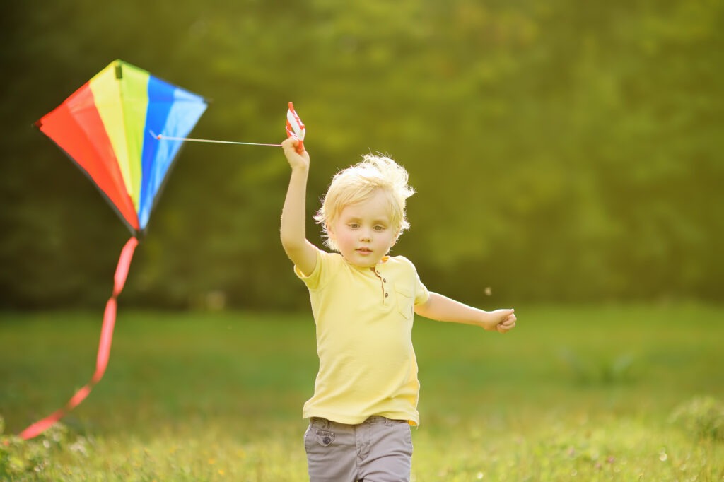 Young boy flying a kite
